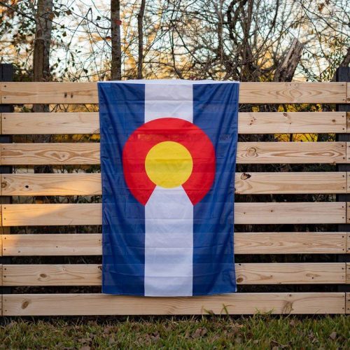 colorado state flag on a fence