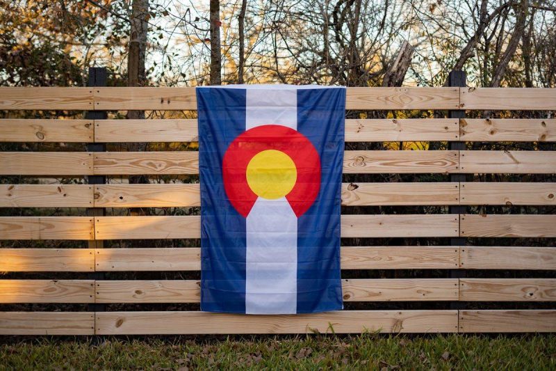 colorado state flag on a fence